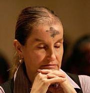 Image of LENTEN ASHES - Bridgette Portelle of Vienna, Va., prays during a Mass at the Basilica of the National Shrine of the Immaculate Conception in Washington on Ash Wednesday, Feb. 6. Ash Wednesday marks the beginning of Lent, the season that calls Christians to prayer, fas ting, repentance and charity. (CNS/Bob Roller)
<br>