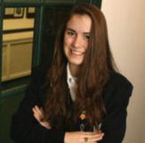 Image of FAIR TRADER - Mount de Sales Academy, Catonsville, student Maria Louzon, is organizing the fourth sale of Fair Trade coffee and chocolates at Church of the Resurrection, Ellicott City. (CR Staff/Owen Sweeney III)
