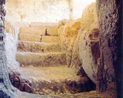 Image of The Tomb, a symbol of Death, will soon burst open through the Power of the Resurrected Christ. He is the hope of the whole human race. On this Holy Saturday, pilgrims wait in silent reverence, focused prayer and anticipation.