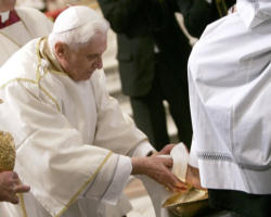 Image of Pope Benedict XVI continues his call to the faithful to allow the deeper meaning of the Eucharist to motivate them to put Love into action by reaching out to feed the hungry and continuing the mission of the Lord through His Church. 