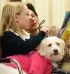 Image of TAIL-WAGGING FUN - Katelynn Ploof reads Dr. Seuss’ “Mr. Brown Can Moo! Can You?” to Miss Maizie the dog, her fourth-grade classmates and her teacher Brenda Pahl at Walbridge St. Jerome School. (Chronicle/Laurie Stevens)