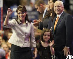 Image of Governor Sarah Palin receiving the congratulatory embrace of the Republican Presidential candidate, Senator John McCain as she accepts his decision to add her to the ticket as the first Republican Female Vice Presidential candidate in American history. 