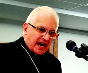 Image of The Bishop stepped up to the microphone. He told those present: “No social issue has caused the death of 50 million people”, referring of course to the current evil of abortion on demand as it exists in the United States of America since the horrible judicial opinions in Roe and Doe. Then he spoke those four words, “This is Madness People.”