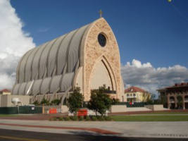 Image of The graduates of Ave Maria University engage in this traditional celebrative act in front of the Oratory on the main Campus in Southwestern Florida.
