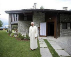 Image of On one of several walks he takes daily during his vacation, the Holy Father continues his pastoral work. 