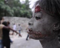 Image of The body of a little girl lies in rubble in Port au Prince, Haiti, Wednesday, Jan. 13, 2010.
