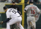 Image of Armando Galarraga takes the throw as umpire Jim Joyce looks on, about to make his controversial call.