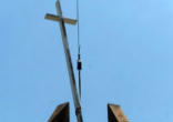 Image of Workers remove the cross from C3 Exchange--formerly Christ Community Church--in Spring Lake, Michigan.
