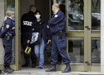 Image of French officials conduct anti-terrorism raids on a routine basis to prevent further acts of violence. 