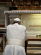 Image of Pope Francis praying at the tomb of Pope John Paul II.