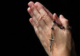 Image of Hands in Prayer with Rosary.