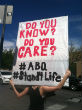 Image of A protester holds a sign during a prayer rally for life.