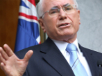 Image of Former Australian Prime Minister John Howard explained that he was unconvinced that catastrophe is approaching. 