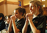 Image of Catholics pray reverently.