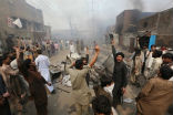 Image of A Buddhist mob in Myanmar caught attacking a Christian enclave. 
