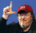 Image of Michael Moore is playing his part on cue. 