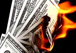 Image of Currency printed out of thin air with nothing to back it devalues the dollar.