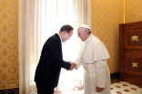 Image of Pope Francis greets UN Secretary General Ban Ki-moon. 