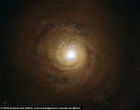 Image of NGC 5548 has a supermassive black hole in its center which is dimmed by its own winds. 