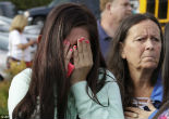 Image of Kids and parents react to news of the shooting.