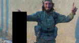 Image of An Islamic State terrorist shared this image of himself posing with the severed head of a female Kurdish fighter. 