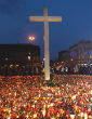 Image of A Christian cross and candles are seen on Pilsudski square in Poland to remember and honor the death of Polish leaders in 2010.