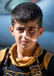 Image of ISIS forces many young boys to become militants, often threatening their families. 
