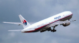 Image of The doomed MH370 in this file photo. What caused the plane to disappear? Was it an accident, a suicide or a hijacking? A newly discovered piece of debris could provide a clue. 