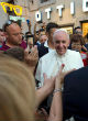Image of Pope Francis was mobbed after appearing outside a prescription glasses store in Rome last week.