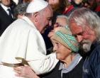 Image of Pope Francis greeting the homeless. 