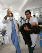 Image of Afghani girls receive medical treatment following a school poisoning (EPA).