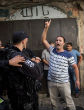 Image of Protesters fought authorities at holy site.