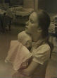 Image of Nurse Susan Berger holds infant Amanda Scarpinati (WTEN-TV).