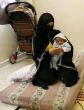 Image of Syrian wives and women call on to their men to come back to Syria and redeem the country (Mohammed Azakir-Reuters)