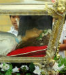 Image of St. Maria Goretti's remains are encased inside a glass-sided casket. Inside the casket is a wax statue, which contains her skeletal remains. None of the sacred remains are visible. Nevertheless, the skeleton is complete, with the exception of small fragments that were taken to be placed in altars and for use in the Church's ministry (mariagorettichicago.com).