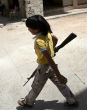 Image of Children are often used as soldiers, or even as suicide bombers. Brainwashing begins at a very young age. 
