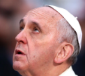 Image of Pope Francis mourns a world at war. 
