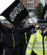 Image of London police escort a Muslim protester. There are some areas in London they fear to tread because of the extreme threat of Islamic terrorism. 