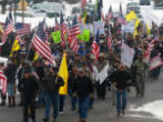 Image of Protesters challenge a federal court order that two men who already served time in jail for arson and released, should return to prison to serve the balance of a 5-year sentence. 