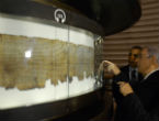 Image of Obama visits the Dead Sea Scrolls in Israel. Scientists are seeking to capture new knowledge fromt he fragments breaking off the scroll. 