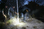 Image of In many places, the border is only defended by a small fence or a few strands of barbed wire. 
