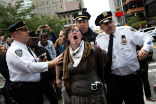 Image of An Occupy protester is arrested during the Occupy Wall Street protests in New York. The long-running demonstrations ended as the weather turned cold. 