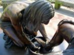 Image of Jesus washed the Disciples' feet to show that nobody is above serving their neighbor. 