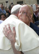 Image of A terminally ill woman meets Pope Francis with an emotional embrace (L'Osservatore Romano/CNS).