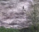 Image of A fisherman is stranded during a flash flood.