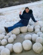 Image of Giant snowballs are piled on a Siberian beach, what does this mean for America?