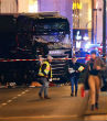 Image of Police are looking for the driver of a big rig truck that plowed into a crowded Christmas market. 