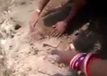Image of  baby girl's feet were found sticking up from the earth.