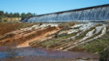 Image of Excessive Drain Flow 'Jetting' from Sidewall Outlets signal Alarm in Spillway Slab Cracks & Poor Sealing of Slab seams.