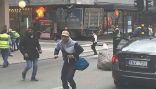 Image of People flee as the terrorist attacker drives into a department store. 
